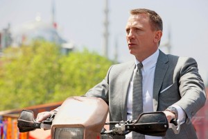 Daniel Craig as Bond on bike skyfall photo