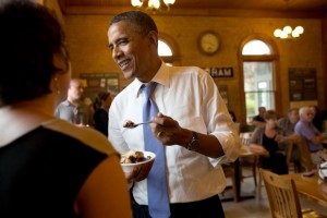 President Barack Obama eats a hot fudge sundae as he talks with patrons at the UNH Dairy Bar on the University of New Hampshire campus in Durham, N.H., June 25, 2012. (Official White House Photo by Pete Souza)