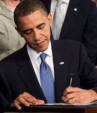 signing Obamacare into law photo