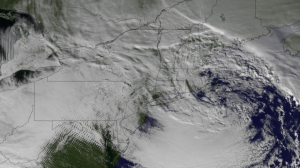 This image from the NOAA GOES-13 satellite shows the Christmas 2012 storm  system on December 27, 2012 at 1845z. The center of low pressure can be seen over New England, along with gravity waves in the cloud formations over Pennsylvania, Maryland, and Virginia.  NOAA photo