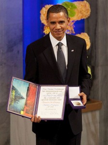 President Barack Obama with the Nobel Prize medal and diploma during the Nobel Peace Prize ceremony in Raadhuset Main Hall at Oslo City Hall in Oslo, Norway, Dec. 10, 2009. Image has been cropped from original. The diploma reads (in English): "The Nobel Committee of the Norwegian Storting has, in accordance with the terms of the will set up by Alfred Nobel on the 27th of November 1895, awarded Barack H. Obama the Nobel Peace Prize for 2009." Photo/Pete Souza/Maison Blanche