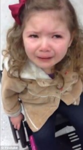 A child in wheelchair crying as TSA delayed her flight to Disney  screenshot of video coverage of story