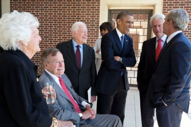 President Barack Obama talks with former Presidents George H.W. Bush, Jimmy Carter, Bill Clinton, George W. Bush, and former First Lady Barbara Bush at the opening of the George W. Bush Presidential Library and Museum in Dallas, Texas, April 25, 2013. First Lady Michelle Obama talks with former First Lady Hillary Rodham Clinton in the background. (Official White House Photo by Pete Souza)