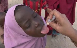 Somali girl receiving oral polio vaccine (OPV) Image/UNICEF Video Screen Shot