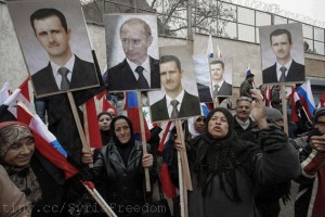 Syrians hold photos of Assad and Putin during a pro-regime protest in front of the Russian embassy in Damascus, Syria, Sunday, March 4, 2012. Flickr FreedomHouse