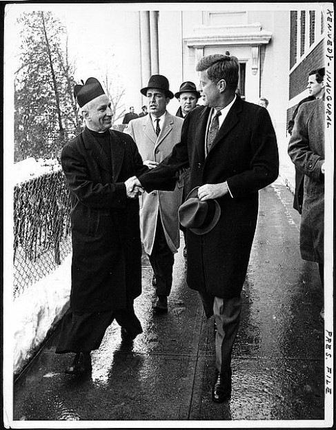 President-elect John F. Kennedy shakes hands with Father Richard J. Casey, the Pastor, after attending Mass at Holy Trinity Church ... prior to inauguration ceremonies, January 20, 1961. Library of Congress.