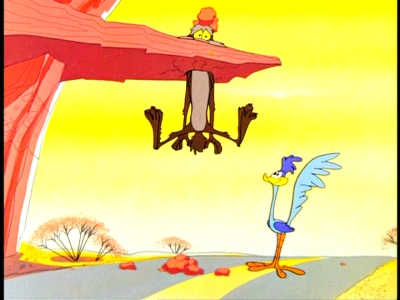 Wile E Coyote Roadrunner head in cliff Zoom and bored