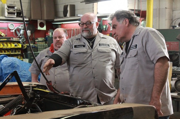 Chuck Kountz, Tommy Christmas, and Andy Pivarnik making a plan for a hemi engine install. photo Discovery Channel