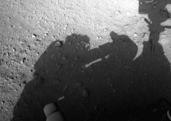 Curiosity Rover casting a shadow. Conspiracy theorists, on the other hand, have pointed out that the shadow near the left-hand side of the picture is clearly a technician, working on the rover in some way, shape or form. photo/ NASA