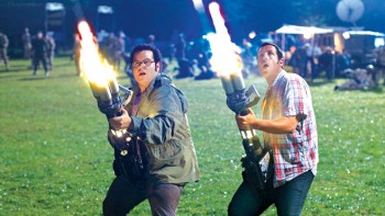 Josh Gad and Adam Sandler battling aliens in "Pixels"