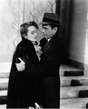 Mary Astor as Bridgid O'Shaughnessy/Miss. Wonderly/Miss. LaBlanc and Humphrey Bogart as Sam Spade, who wears hat/fedora in "The Maltese Falcon"