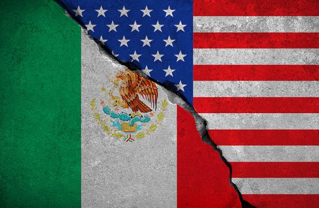 mexico flag on broken brick wall and half usa united states of america flag