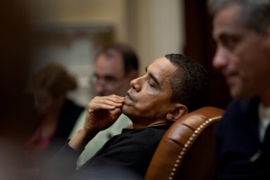 President Obama reflects during an economic meeting with advisors in the Roosevelt Room. He is seated between Senior Advisor David Axelrod and Chief of Staff Rahm Emanuel , right. 3/15/09. Official White House Photo by Pete Souza