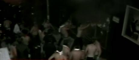 People trying to save those trapped inside the burning nightclub.  Image/Video Screen Shot