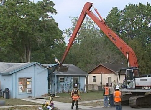 crane sinkhole home flag removed Jeff Bush home