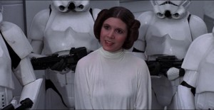 Carrie Fisher as Princess Leia surrounded by Stormtroopers
