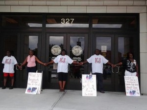 Kendrick Johnson's parents and supporters were arrested after blocking the federal building on Thursday photo Facebook