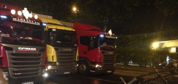 protesters use semi trucks to create a blockade of their own