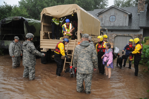 National Guardsmen respond to floods in Boulder County, Colo., Sept.12, 2013. The Guard is working with local agencies to help people in the area affected by the flooding by evacuating people using high-clearance vehicles. (Army National Guard Photo by Sgt. Joseph K. VonNida/Released) 