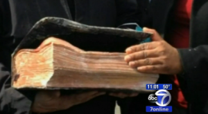 screenshot of video coverage of gas explosion, Bible that survived