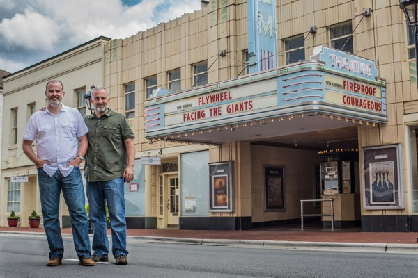 Alex and Stephen Kendrick pose outside The Gem Theater in historic downtown Kannapolis, N.C., after filming car scenes for their new movie. (Courtesy of AFFIRM Films/Provident Films, Photo credit: Kevin Peeples)