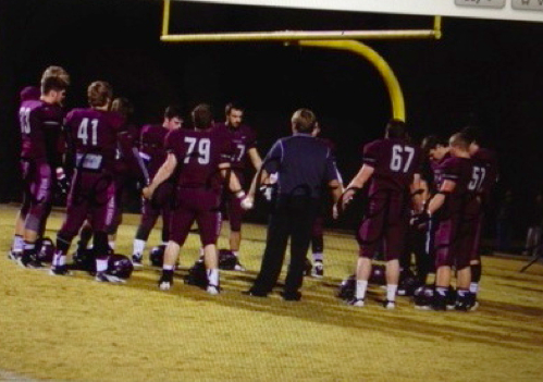A Florida school district caves to a Freedom From Religion threats  photo Georgia high school team praying before a game/ American Humanist Association