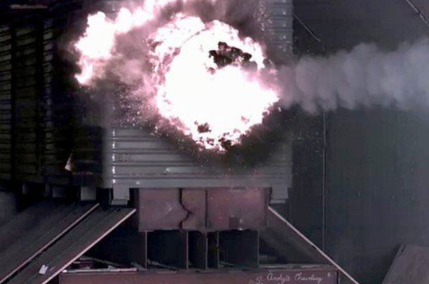 In this Jan. 28, 2007 photo, a test slug impacts the target after being fired from the Electromagnetic Railgun laboratory launcher, or railgun at the Naval Surface Warfare Center, in Dahlgren, Va.  (U.S. Navy, John F. Williams)