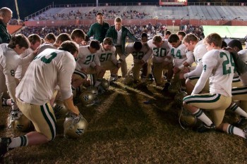 Woodlawn football team praying