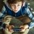 Fashionable teenager boy in headphones and with a mobile phone playing an Internet game. The dependence of children from online games. Internet addiction